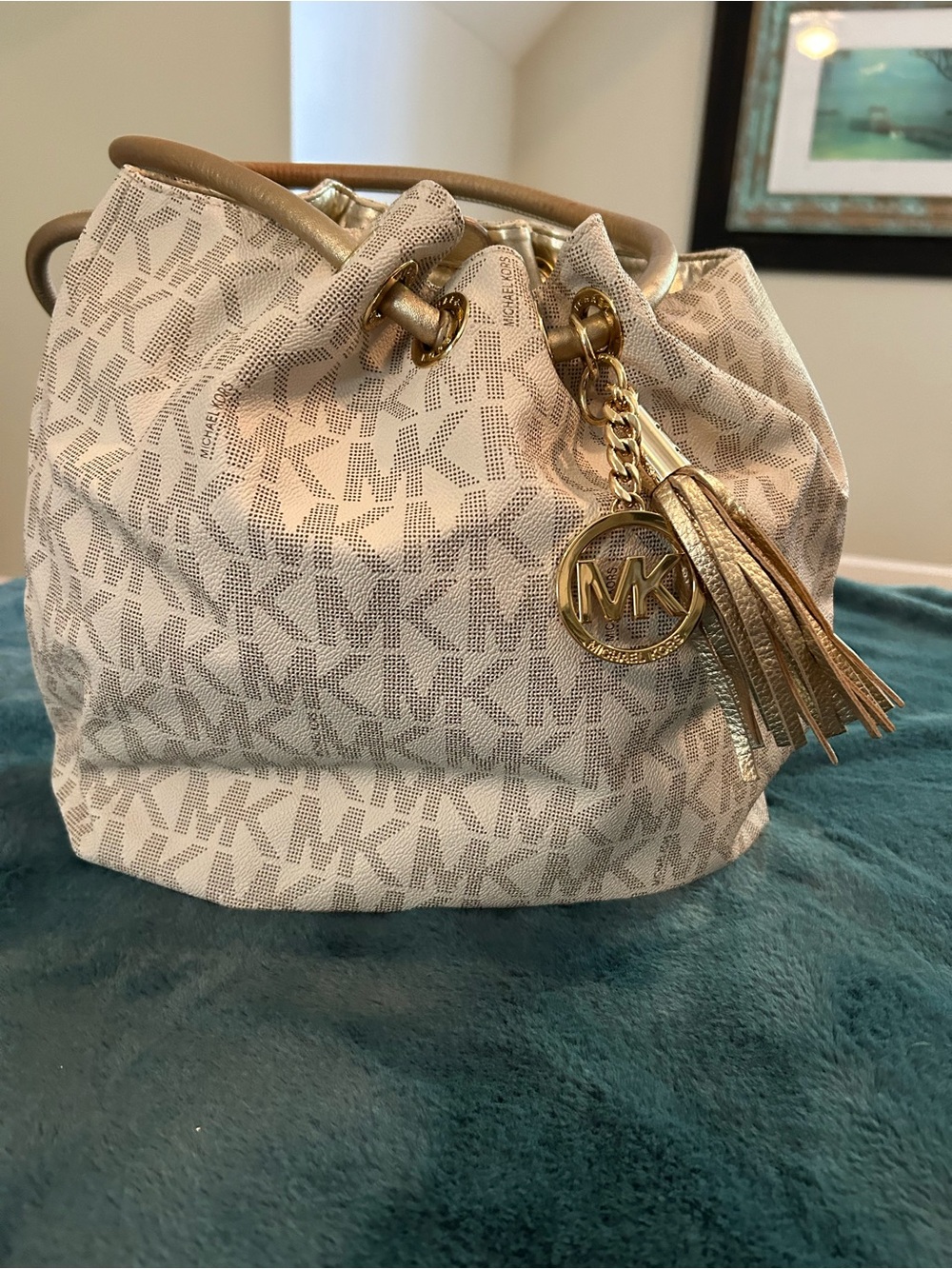 Michael Kors Cream Logo Drawstring Bucket Bag with Gold Tassel Charm